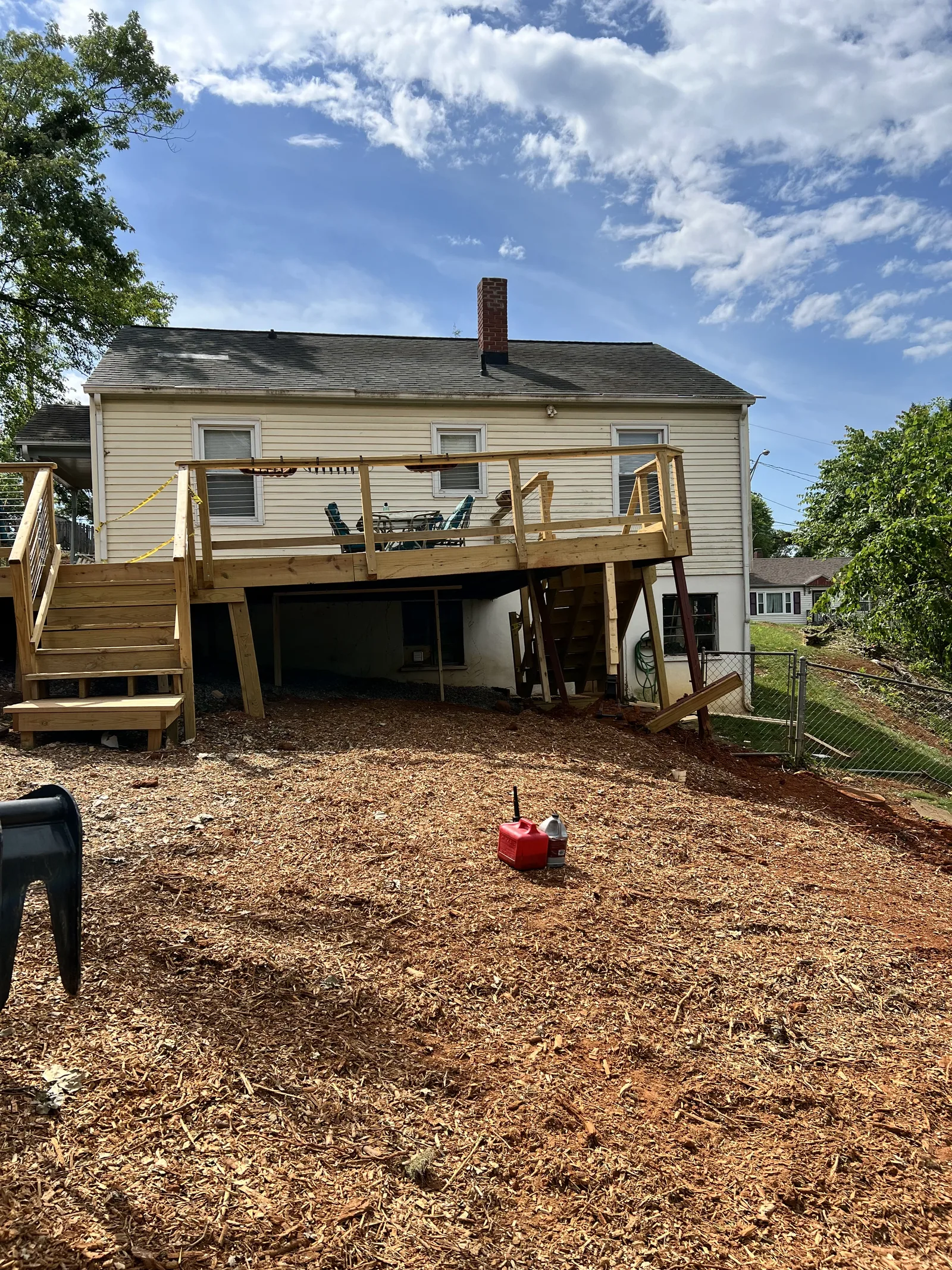 Cleared yard fully cleaned and covered with fresh mulch after tree removal